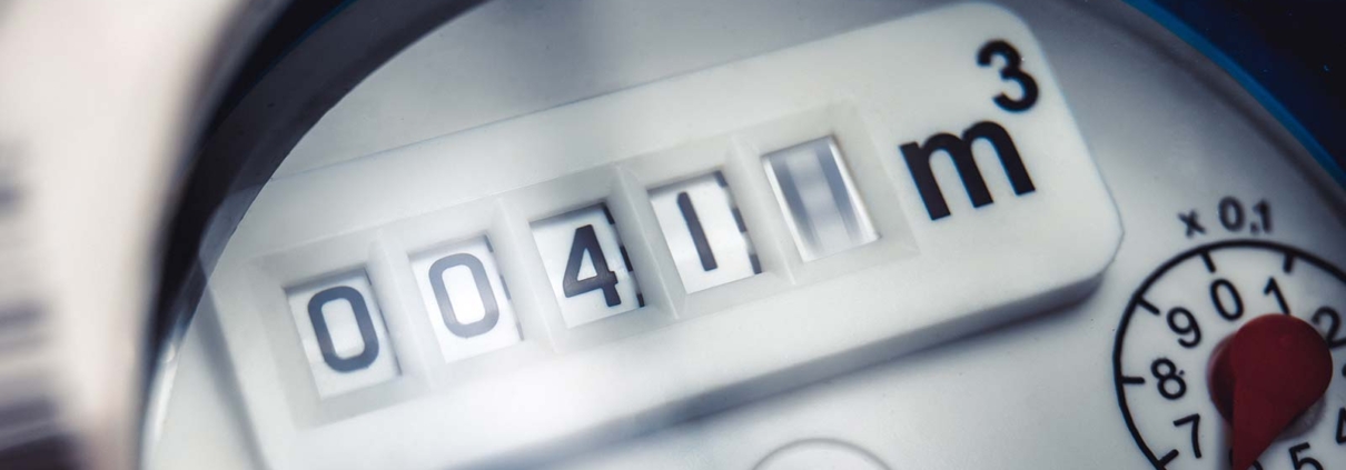 Close up of water meter with rotating digit