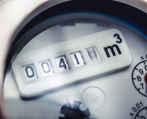 Close up of water meter with rotating digit