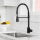 black kitchen faucet over stainless steel farmer's sink