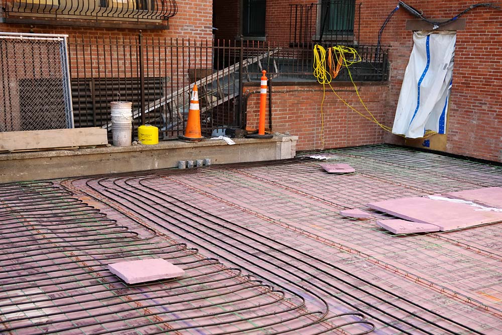 Hydronic snow melt system installed on exterior slab before concrete pour.